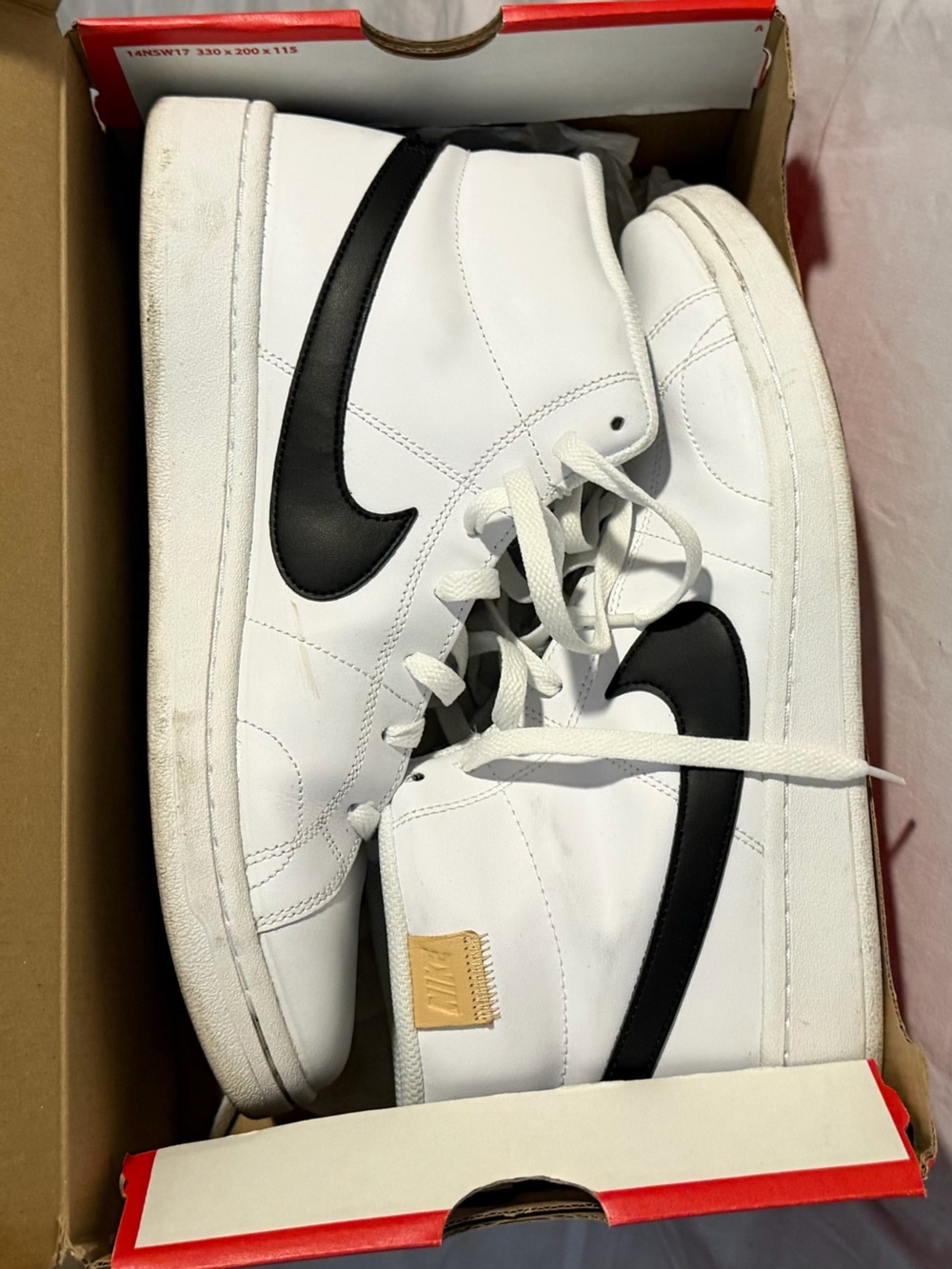 Nike Men’s White and Black Mid-Top Sneakers